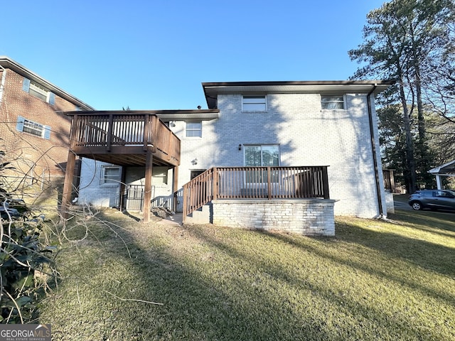 back of property with a wooden deck and a lawn