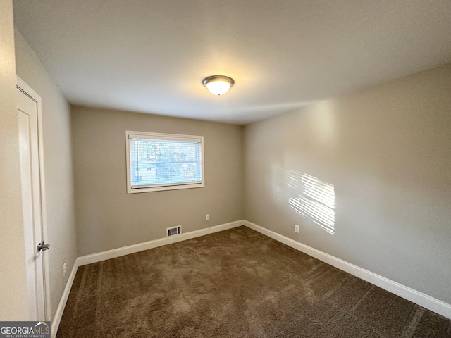 view of carpeted spare room