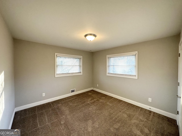 view of carpeted spare room