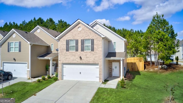 view of front of house featuring a front lawn and a garage