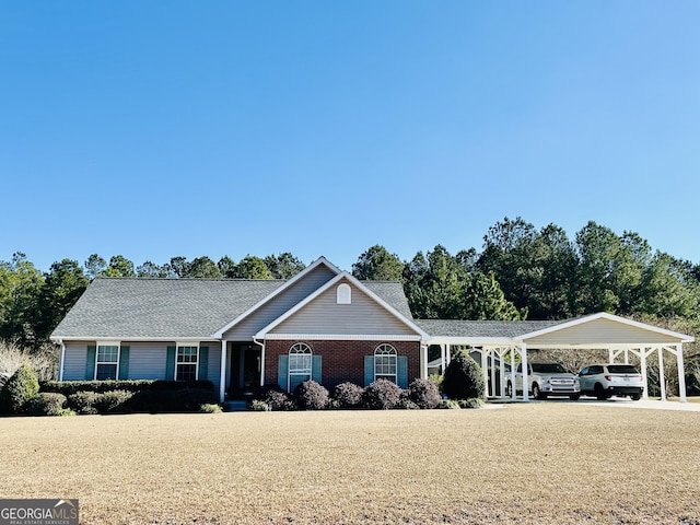 single story home featuring a front yard and a carport