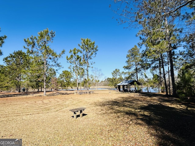 view of yard with a water view and a gazebo