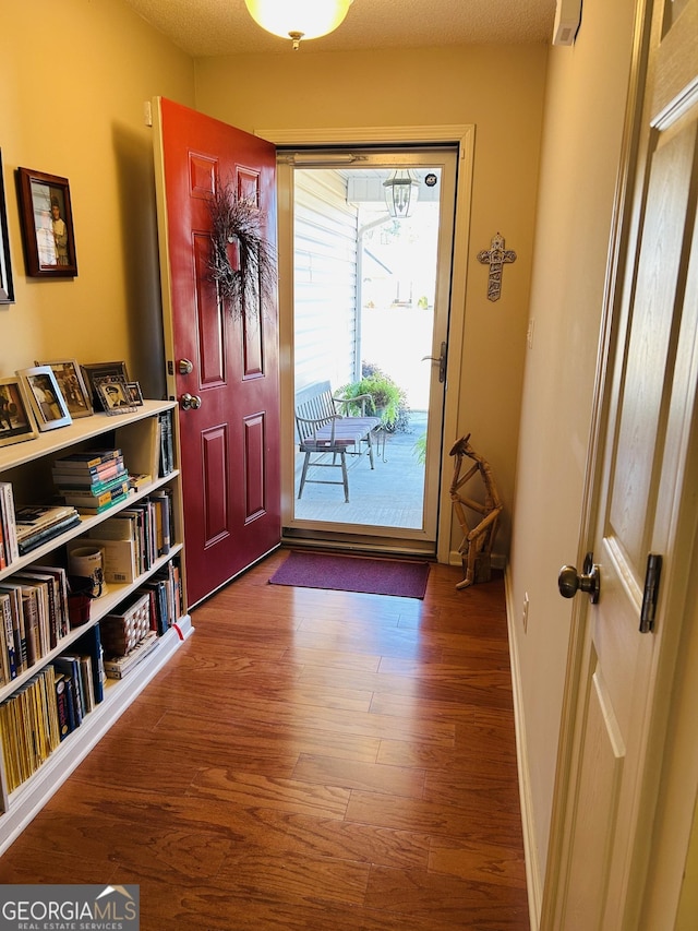 foyer with wood-type flooring