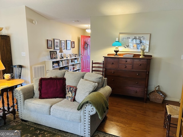 living room featuring dark hardwood / wood-style flooring