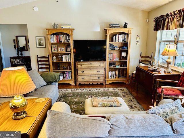 living room with lofted ceiling and hardwood / wood-style floors