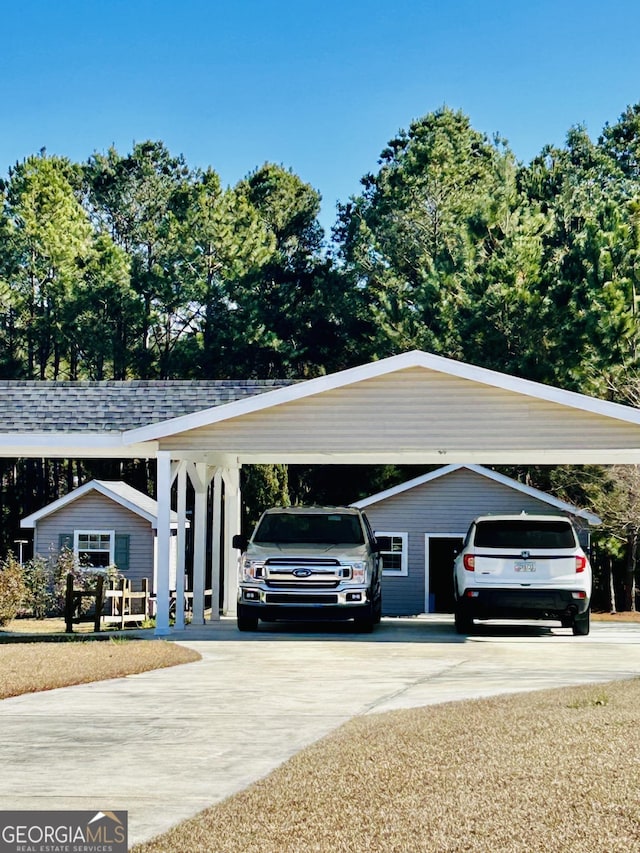 view of vehicle parking featuring a carport