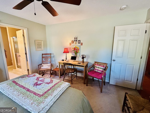 bedroom featuring ceiling fan, connected bathroom, and carpet floors