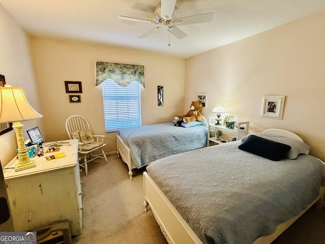 bedroom featuring ceiling fan and light colored carpet