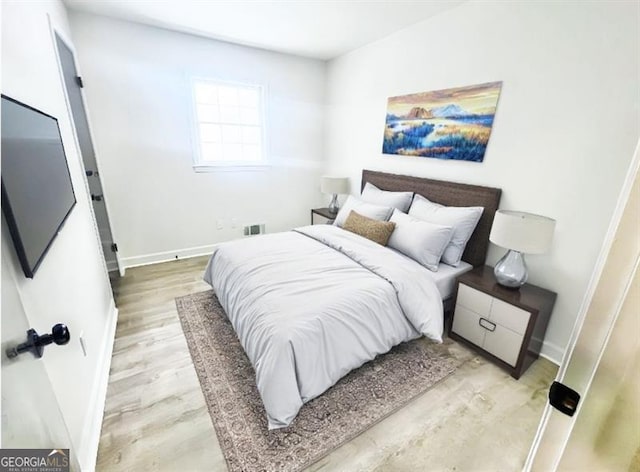 bedroom with light hardwood / wood-style flooring