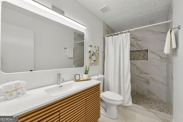 bathroom with toilet, a shower with shower curtain, and vanity