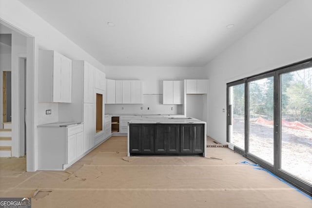 kitchen with white cabinetry and a center island