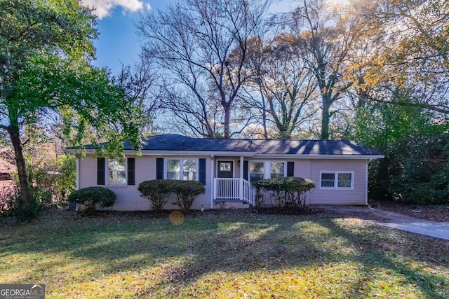 ranch-style house with a front lawn