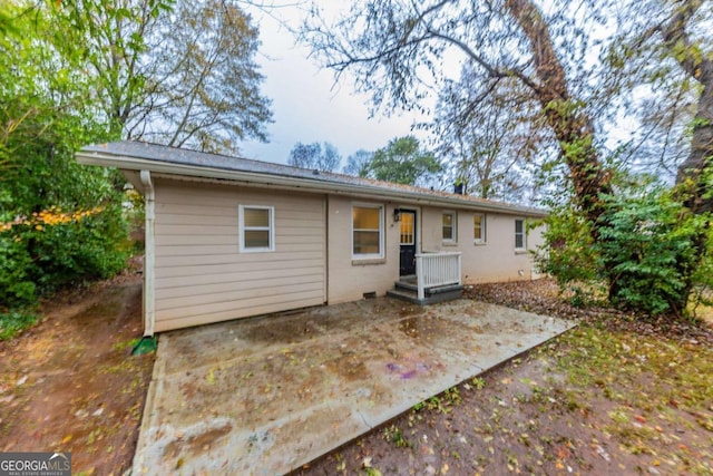 rear view of property with a patio area