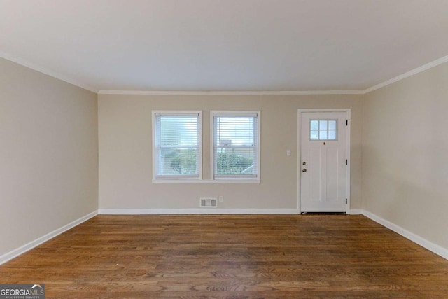 entryway featuring dark hardwood / wood-style flooring and ornamental molding