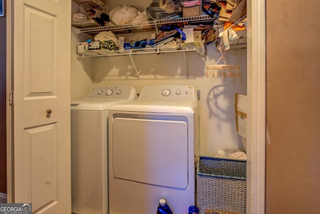 laundry area with washing machine and clothes dryer