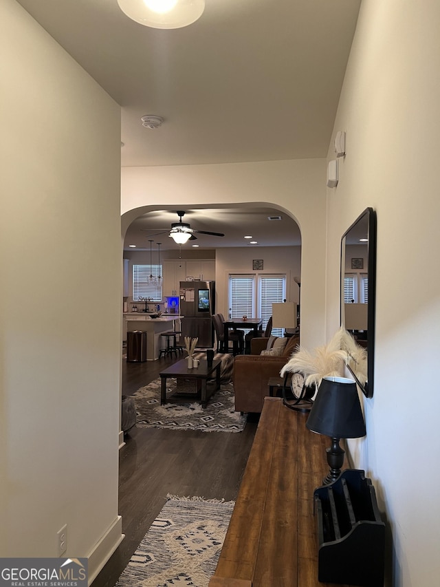 hallway with hardwood / wood-style flooring