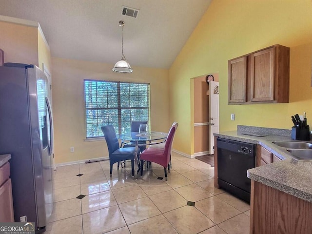 tiled dining space featuring vaulted ceiling and sink