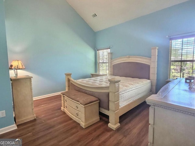 bedroom with dark wood-type flooring and lofted ceiling