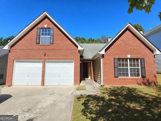 view of front property featuring a front lawn and a garage