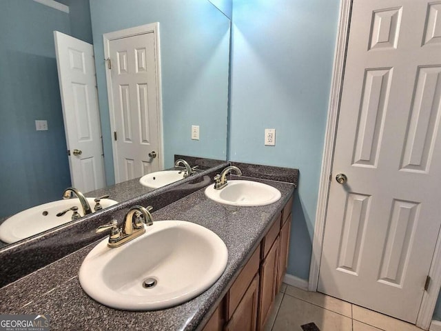 bathroom with tile patterned floors and vanity