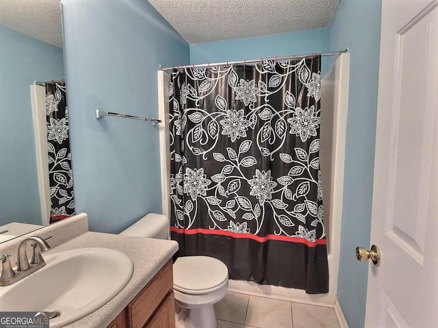 full bathroom with toilet, vanity, tile patterned flooring, and a textured ceiling