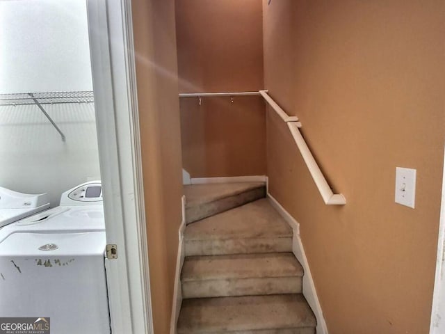 stairs featuring independent washer and dryer