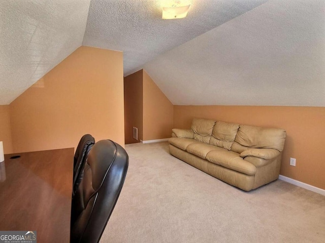 additional living space with carpet, vaulted ceiling, and a textured ceiling