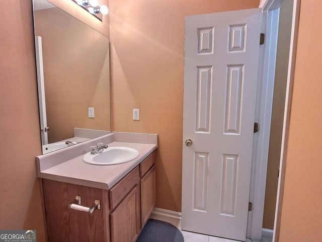 bathroom with tile patterned flooring and vanity