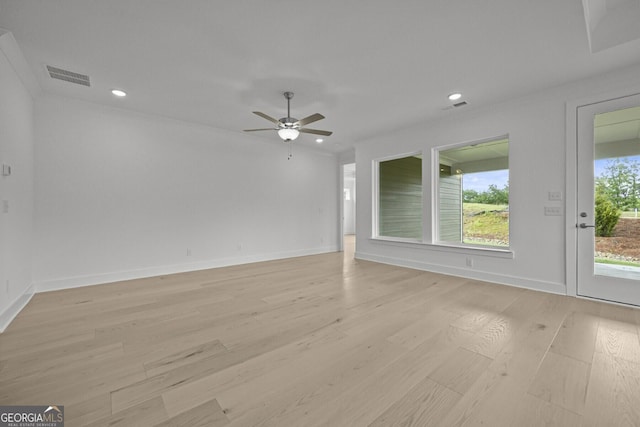 empty room with light wood-type flooring, a ceiling fan, baseboards, and recessed lighting