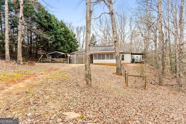 view of front facade with a garage and a carport