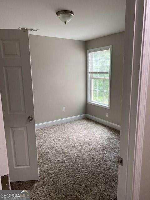 spare room with carpet