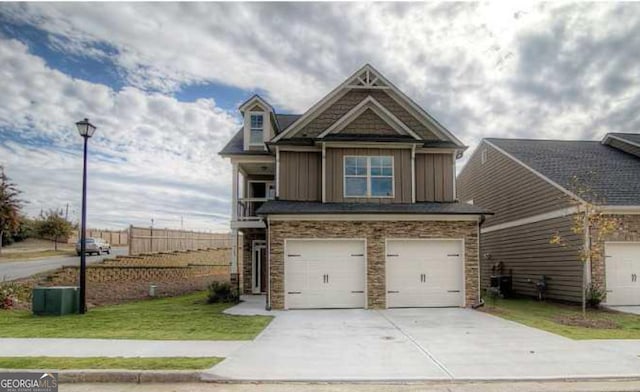 view of front of property with a garage and a front yard