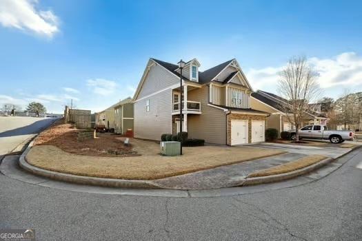 view of side of property featuring a garage