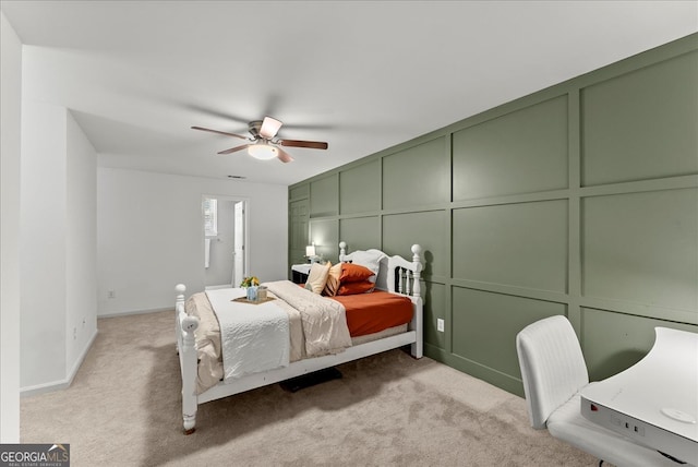 bedroom with light carpet and ceiling fan