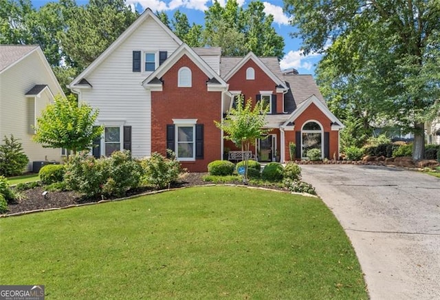 front facade with a front lawn