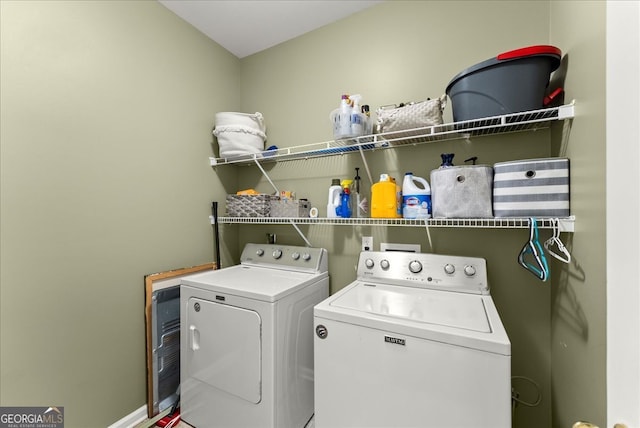 washroom featuring washing machine and dryer