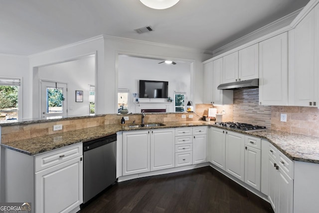 kitchen featuring white cabinetry, stainless steel appliances, sink, and dark stone countertops