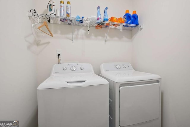 laundry area with washing machine and clothes dryer