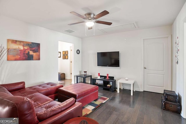 living room featuring ceiling fan and dark hardwood / wood-style floors