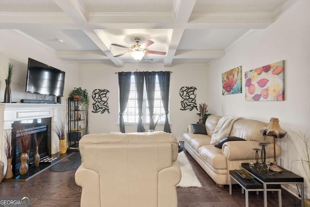 living room with dark wood-type flooring, coffered ceiling, crown molding, ceiling fan, and beam ceiling