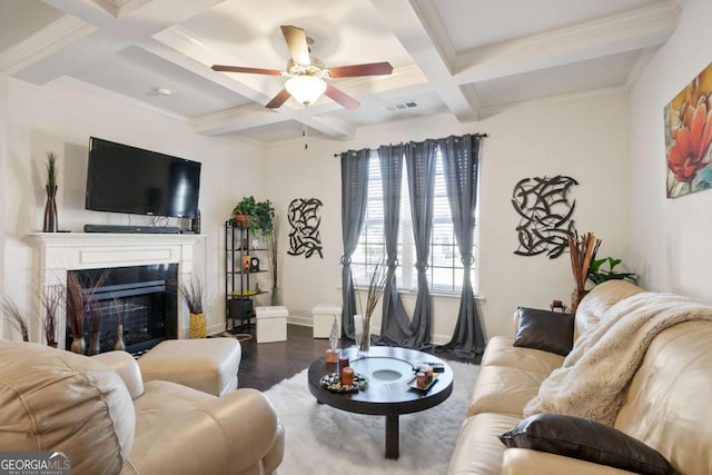 living room with hardwood / wood-style floors, coffered ceiling, ceiling fan, a high end fireplace, and beam ceiling