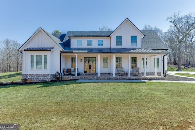 modern inspired farmhouse with a standing seam roof, a shingled roof, board and batten siding, and covered porch