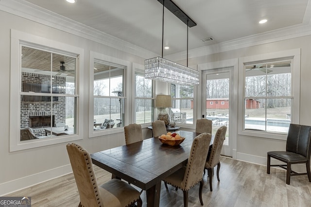 4621 Stanley Rd, Flowery Branch, GA 30542 - dining room with crown molding, baseboards, light wood-style flooring, ceiling fan, and recessed lighting