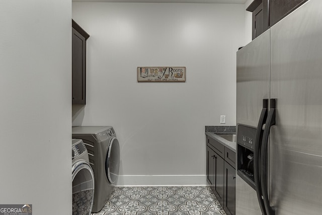 4621 Stanley Rd, Flowery Branch, GA 30542 - laundry area with cabinet space, independent washer and dryer, baseboards, and tile patterned floors