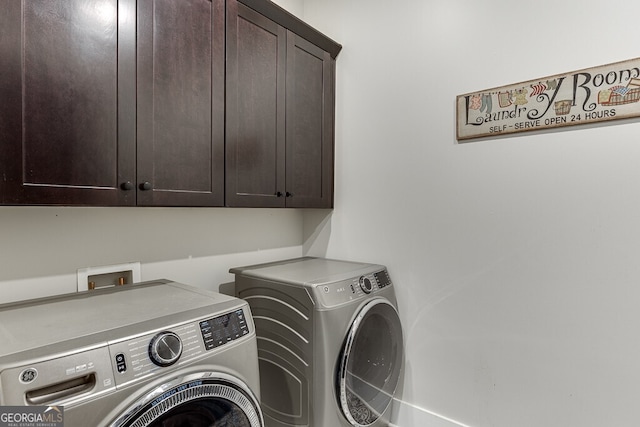 4621 Stanley Rd, Flowery Branch, GA 30542 - washroom with cabinet space and washer and dryer