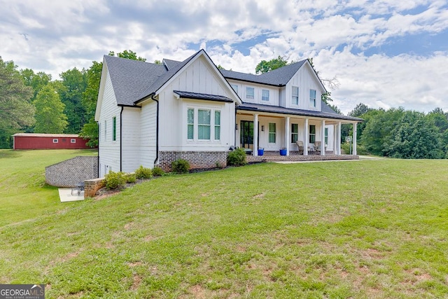 4621 Stanley Rd, Flowery Branch, GA 30542 - modern farmhouse style home featuring covered porch, board and batten siding, and a front yard