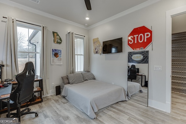 4621 Stanley Rd, Flowery Branch, GA 30542 - bedroom featuring ornamental molding, an office area, light wood finished floors, ceiling fan, and baseboards