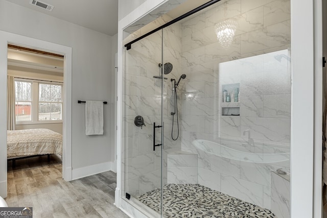 4621 Stanley Rd, Flowery Branch, GA 30542 - ensuite bathroom with a marble finish shower, baseboards, and wood finished floors