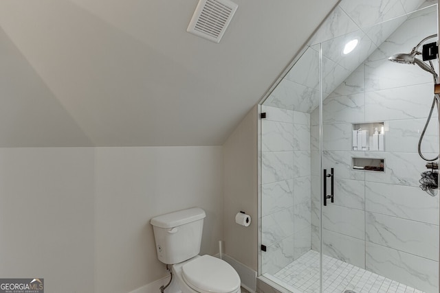 4621 Stanley Rd, Flowery Branch, GA 30542 - bathroom with toilet, a stall shower, baseboards, and lofted ceiling