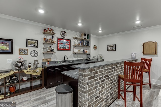 4621 Stanley Rd, Flowery Branch, GA 30542 - indoor wet bar featuring crown molding, light wood-type flooring, and recessed lighting